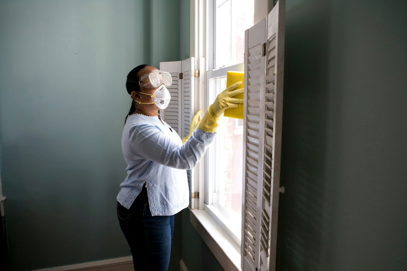 A homeowner inspecting completed repair work with a technician