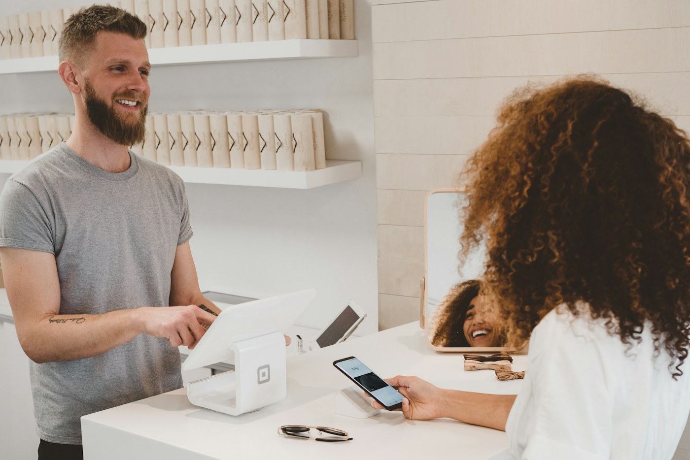 A shopper checking itemized charges on a receipt